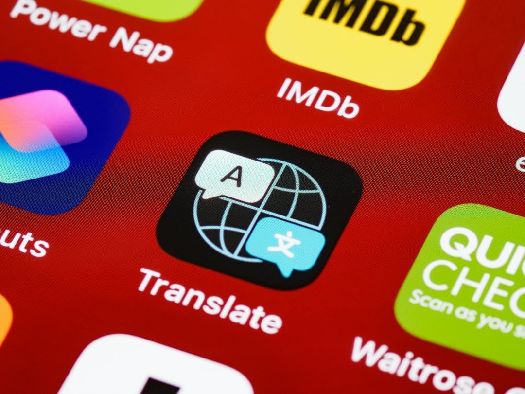 Smartphone screen displaying app icons including the Translate app.
